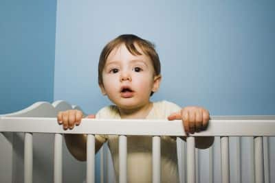 toddler in crib