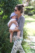 Alessandra Ambrosio holds her son Noah Mazur close, as they make a quick stop at the Brentwood Country Mart in Los Angeles