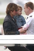 **EXCLUSIVE** Keith Urban and his daughters Sunday Rose and Faith Margaret are seen boarding a private plane at Van Nuys Airport in Los Angeles