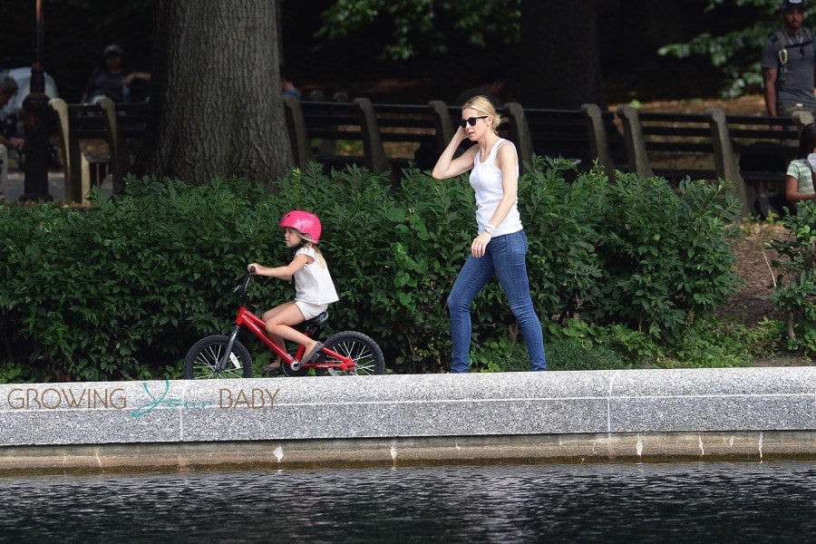 Helena Giersch rises her bike in Central Park - Growing Your Baby