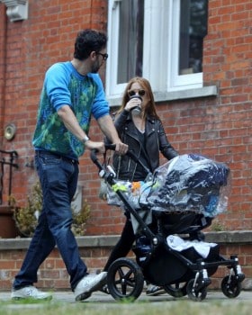 Isla Fisher and Sacha Baron Cohen take their 4-month-old baby Montgomery Moses Brian for a stroll