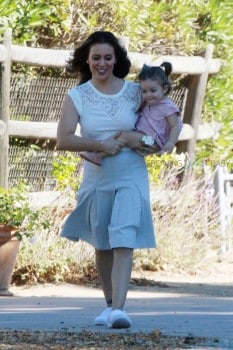 Alyssa Milano carries daughter Elizabella on the set of her new commercial