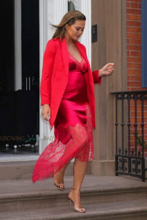 Pregnant Chrissy Teigen Rocks A Red Slip Dress In Nyc 