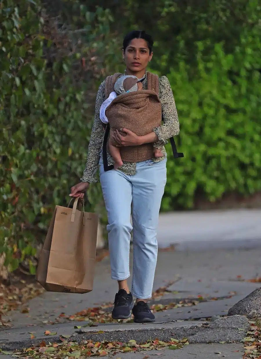 Freida Pinto With New Son In A Artipoppe Zeitgeist Marron Baby Carrier ...