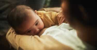 Baby Feeding from the Breast of Her Mother