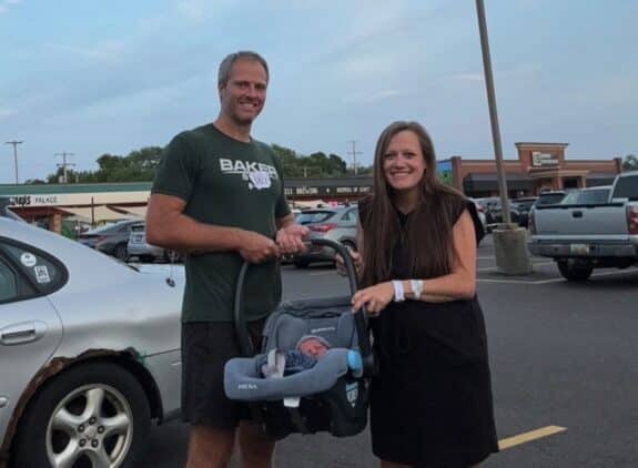 Kyle and Aaron Baker with new baby Forest