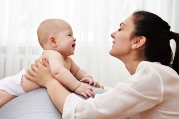 woman staring into babys eyes