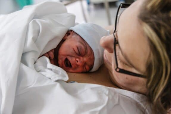 Mother with newborn baby just finished giving birth