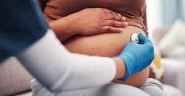 pregnant and woman with healthcare checkup