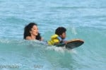 Kimora Lee Simmons plays in the ocean with son Kenzo